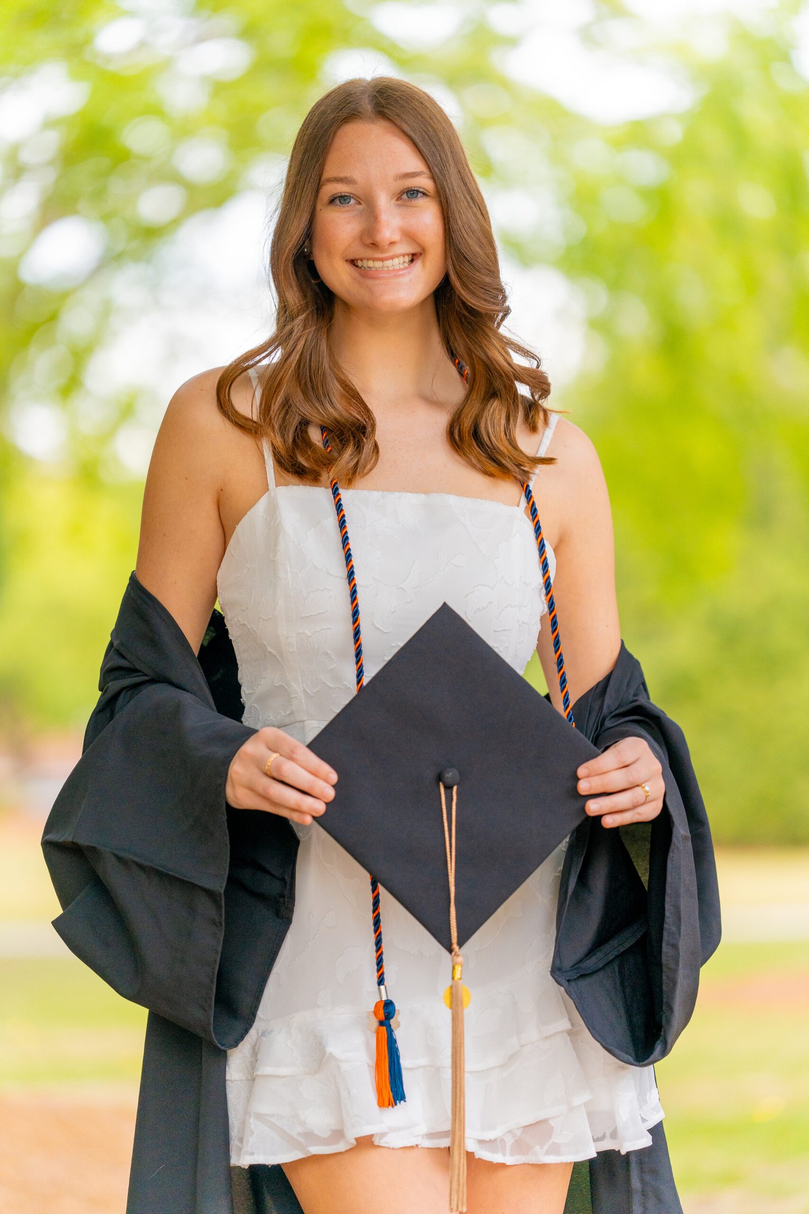 Graduate holding her cap